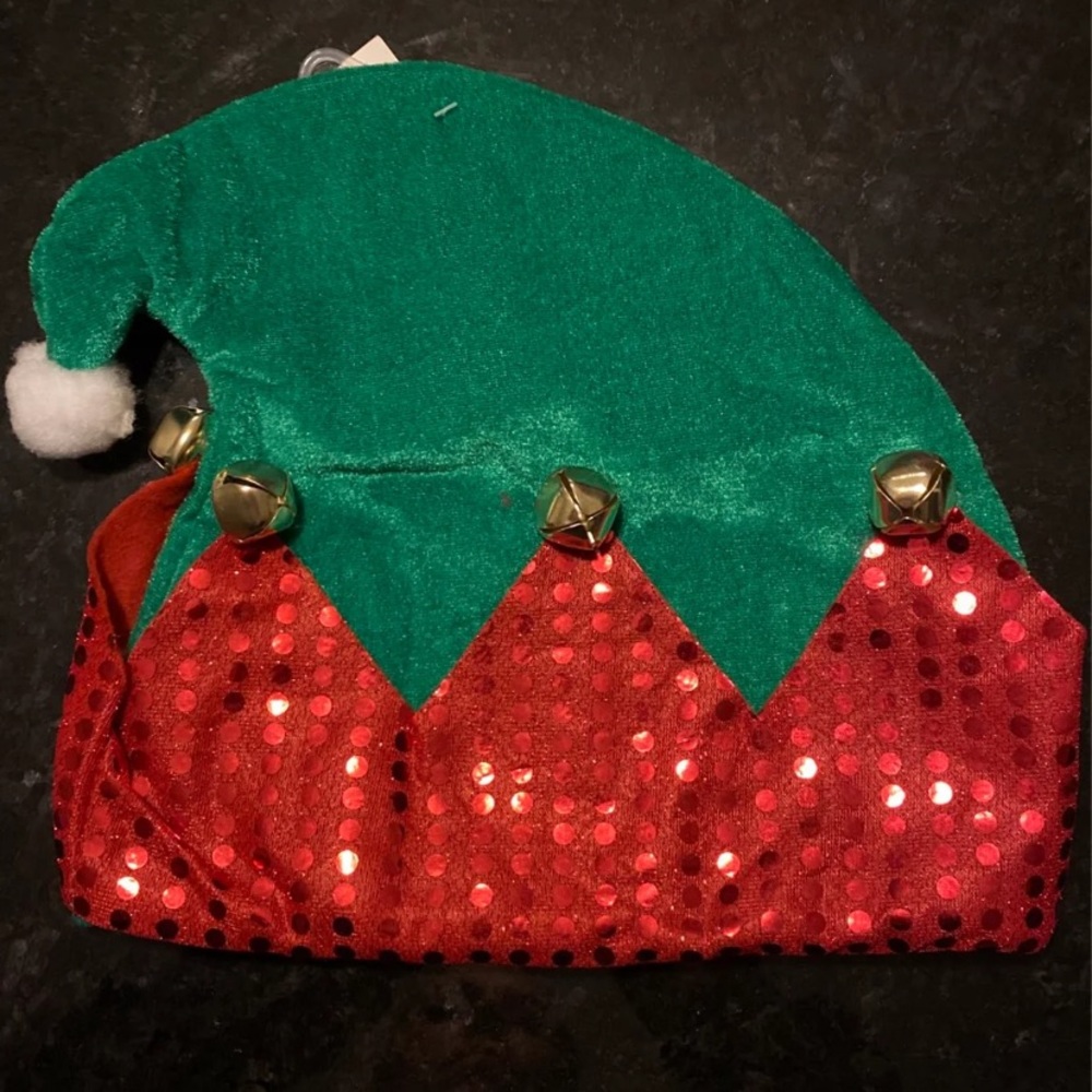 Elf hat green or red. Trimmed with red glitter and gold bells.